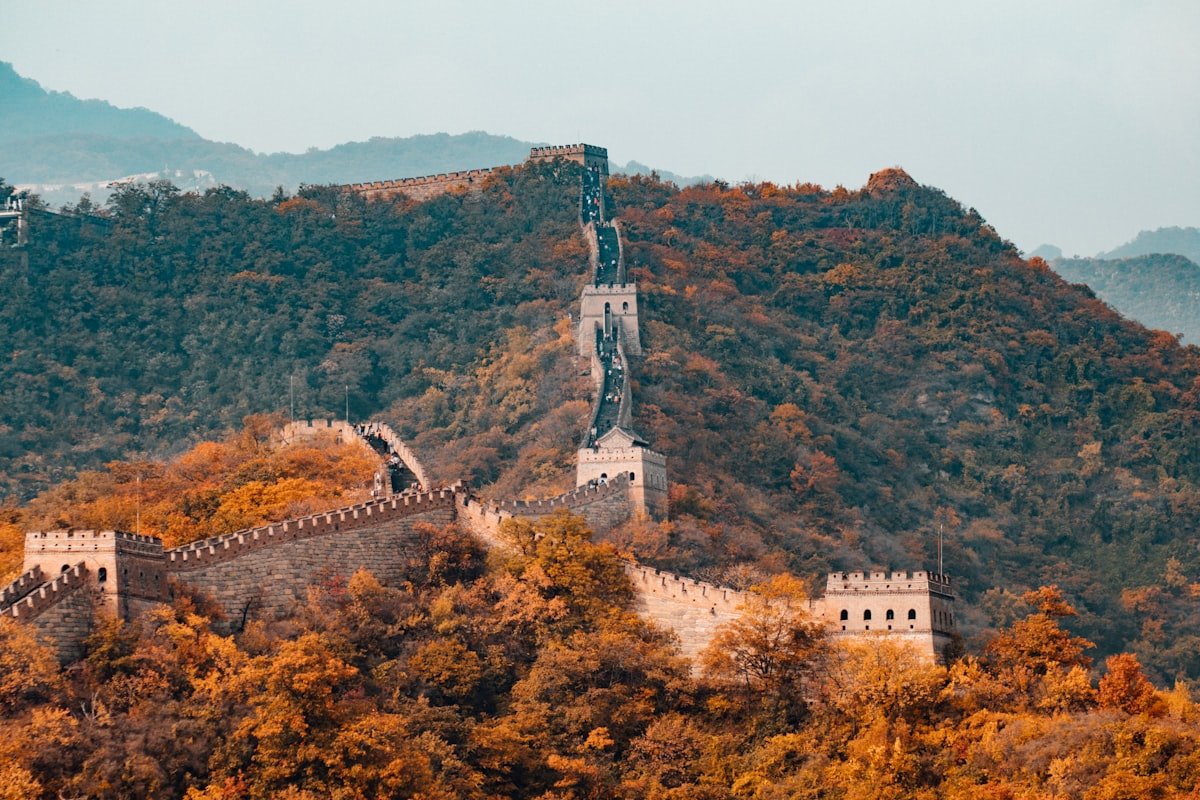 Travellers hiking the Great Wall at sunrise